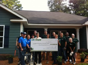 Call2Recycle presents a check to NW Metro Habitat for Humanity 